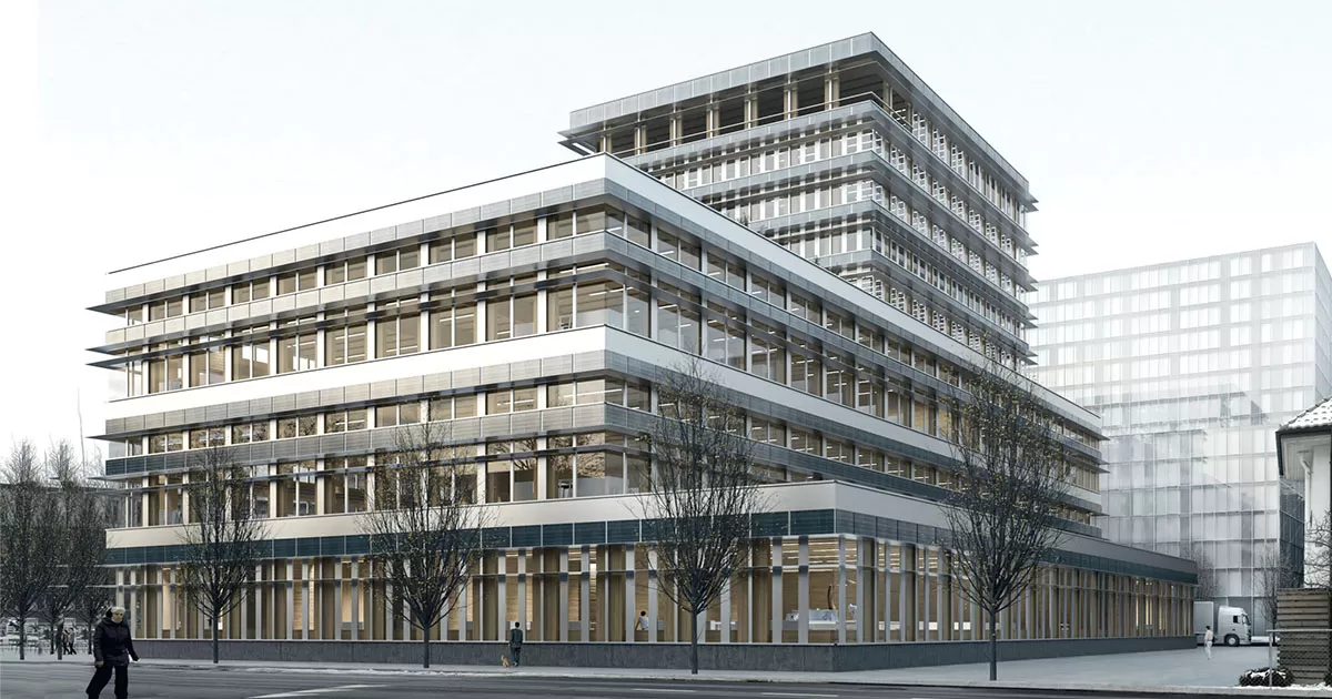 Geb&auml;ude mit kahlen B&auml;umen im Vordergrund