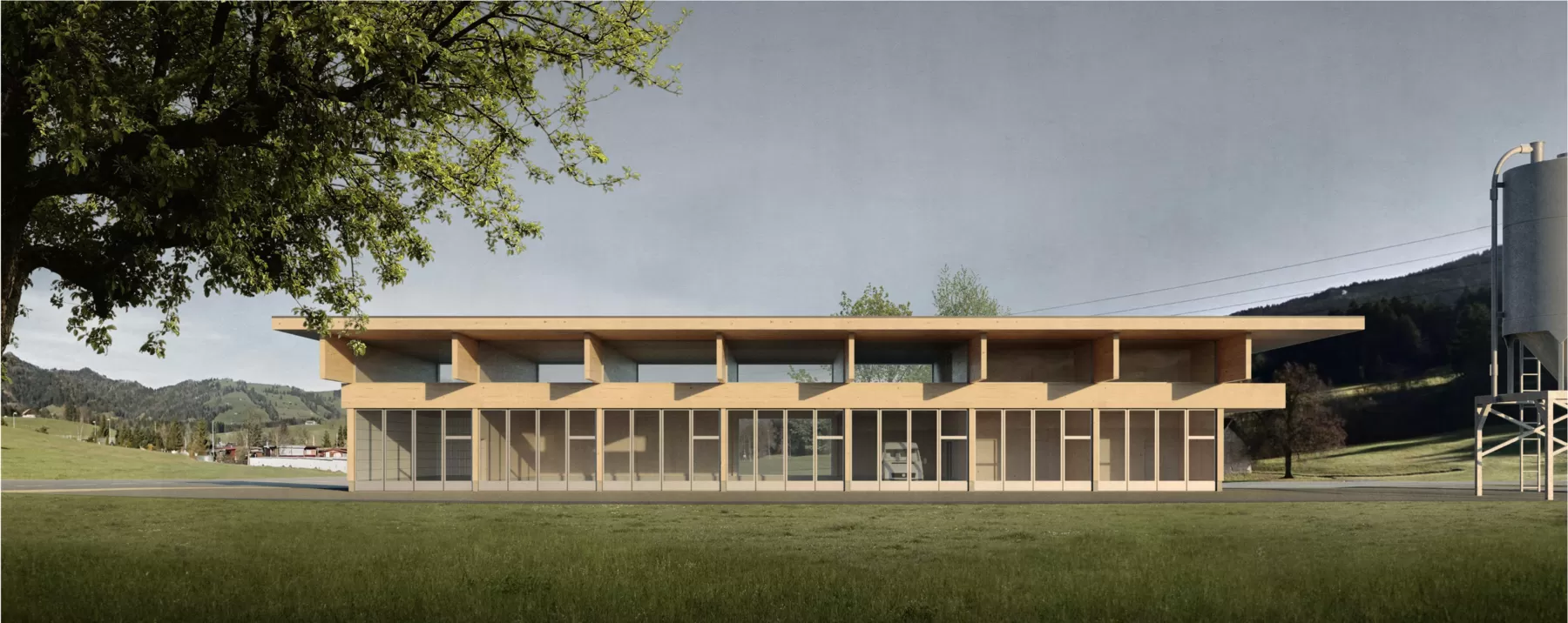 Geb&auml;ude mit Holzkonstruktion auf einer gr&uuml;nen Wiese